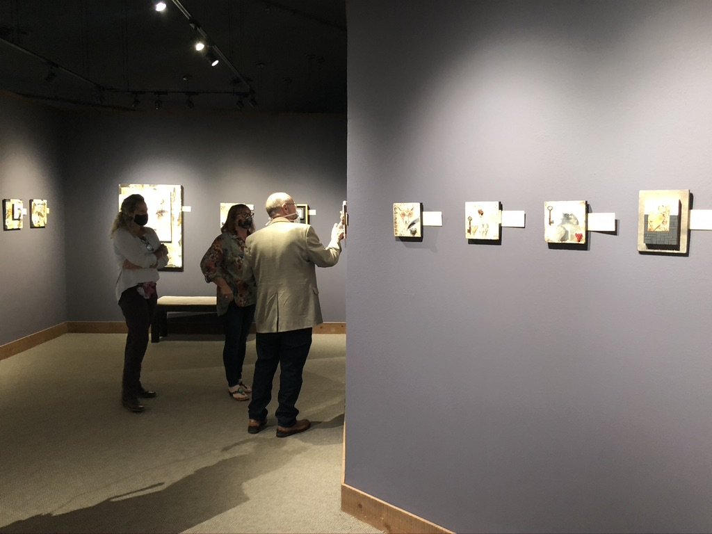 Visitors engaging with art in the gallery space